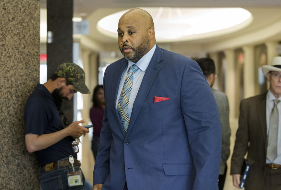 Former Harris County Sheriff's Office Deputy Cameron Brewer walks into the courtroom for the opening arguments of his case at Harris County Civil Courthouse on Thursday, Aug. 1, 2019, in Houston. Brewer is charged with aggravated assault by a public servant for the death of Danny Ray Thomas in 2018. (Yi-Chin Lee/Houston Chronicle via AP)