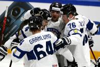 Team of Finland celebrate a goal during the 2022 IIHF Ice Hockey World Championships preliminary round group B match between Latvia and Finland in Tampere, Finland, Saturday, May 14, 2022. (Emmi Korhonen/Lehtikuva via AP)