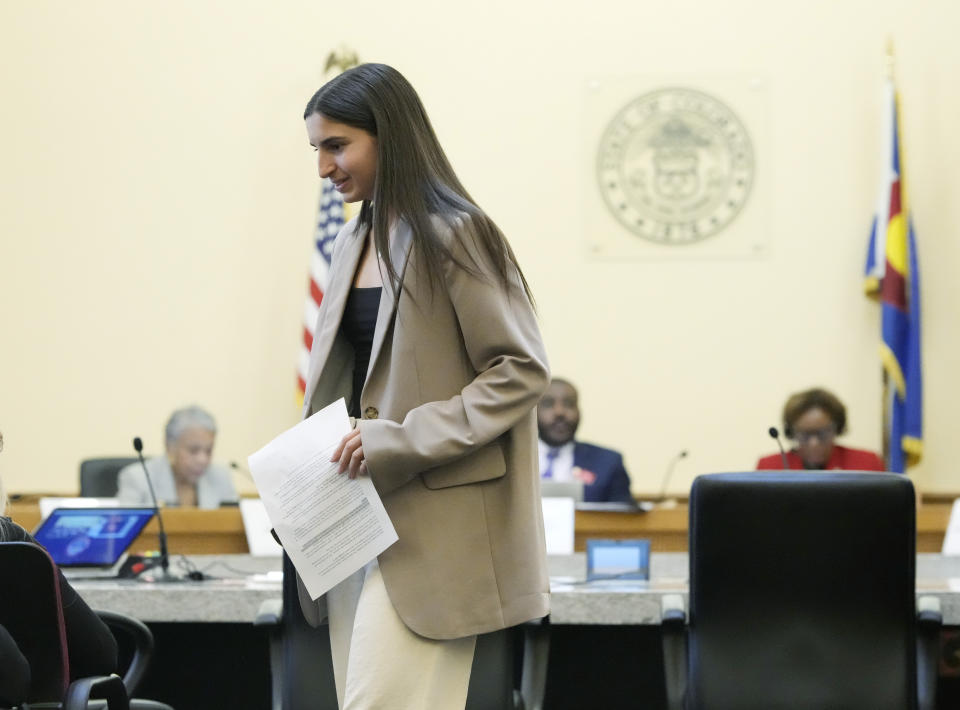 Emma Warford, a patient ambassador for pediatric mental health at Children's Hospital Colorado and a senior at Rock Canyon High School in Highlands Ranch, Colo., heads back to the gallery after testifying during a Colorado Senate hearing on measures to address eating disordersm Thursday, March 23, 2023, at the State Capitol in Denver. Lawmakers in states including Colorado, California, Texas and New York are taking big legislative swings at the eating disorder crisis that is bedeviling Americans. (AP Photo/David Zalubowski)