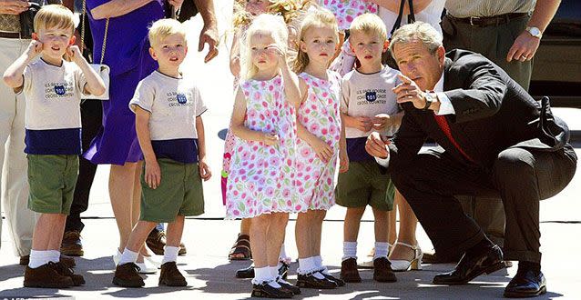 President George W Bush Jnr with the children. Picture: AP