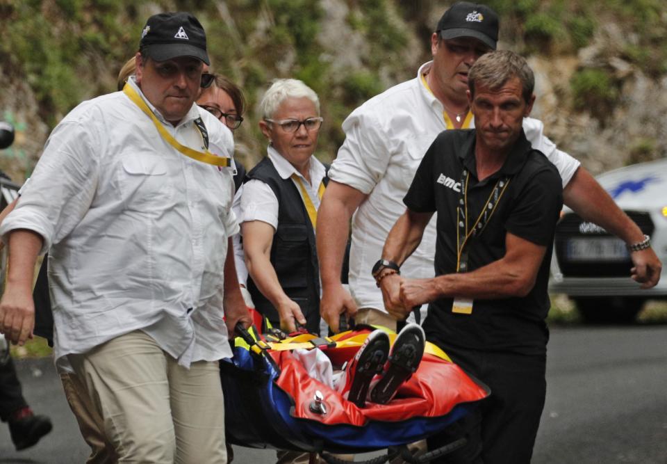 Australia's Richie Porte is carried to an ambulance after crashing in the descent of the Mont du Chat pass during the ninth stage of the Tour de France.