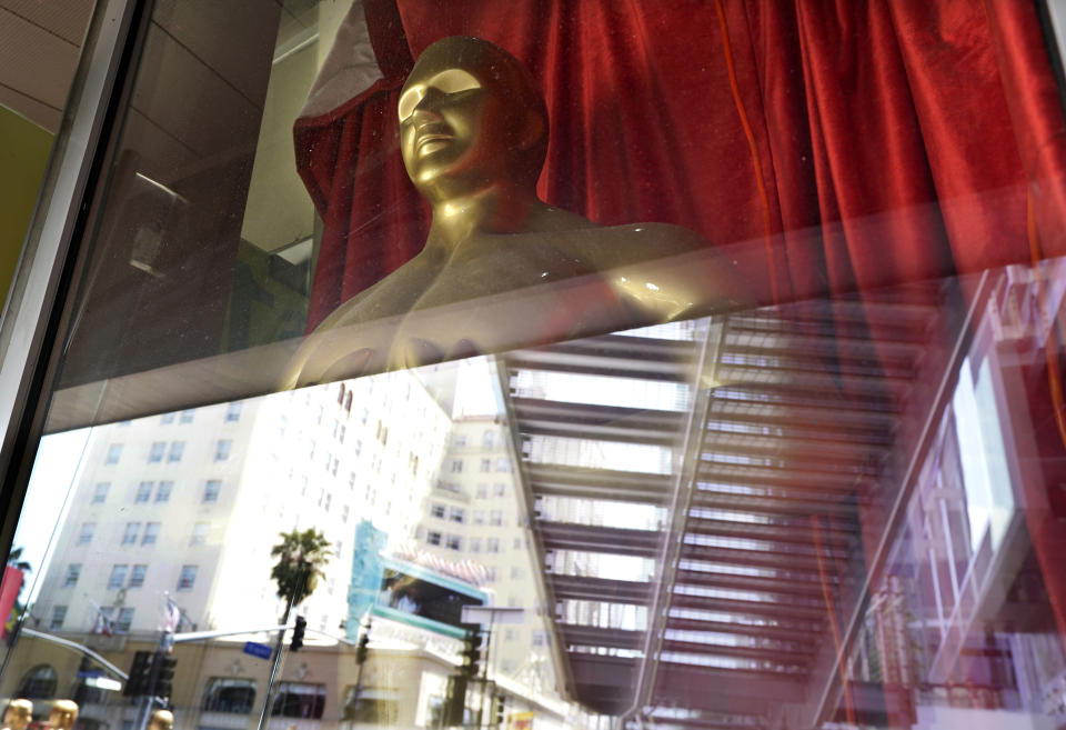 A fake Oscar statue is pictured in the window of a gift shop on Hollywood Blvd., Thursday, April 15, 2021, in Los Angeles. The 93rd Academy Awards will be held in various locations including the Dolby Theatre in Hollywood on Sunday, April 25. (AP Photo/Chris Pizzello)