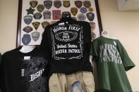 <p>T-shirts await sale in a souvenir shop at the Federal Law Enforcement Training Center on August 2, 2017 in Artesia, N.M. (Photo: John Moore/Getty Images) </p>