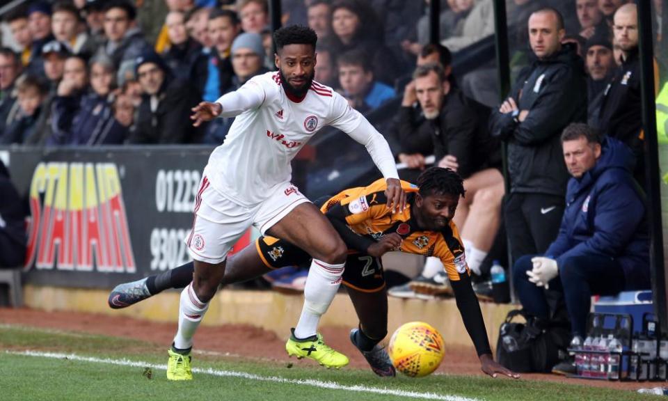 Janoi Donacien of Accrington gets the better of Medy Elito during the game.