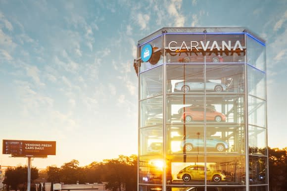 A close-up of the Carvana vending tower, glass-sided and full of cars.