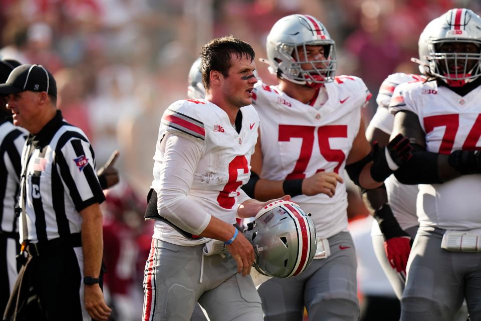 Sep 2, 2023; Bloomington, Indiana, USA; Ohio State Buckeyes quarterback Kyle McCord (6) walks off the field after his helmet popped off during the NCAA football game at Indiana University Memorial Stadium. Ohio State won 23-3.