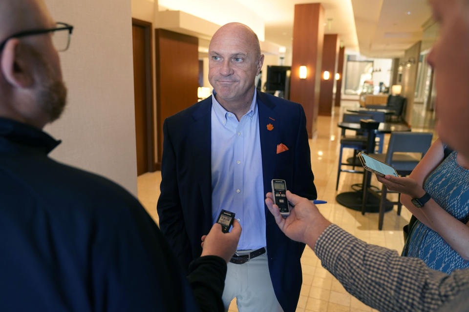 Clemson University President Jim Clements listens to a reporters question after the College Football Playoff presidents group meeting Tuesday, June 22, 2021, in Grapevine, Texas. The CFP met to discuss a proposed plan to expand the postseason format from four to 12 teams. (AP Photo/LM Otero)