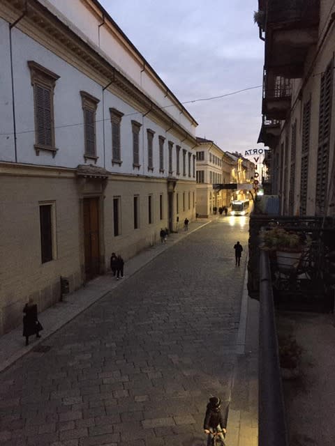 This street in Pavia would usually be packed at the time of day in the photo – late afternoon – but only a handful of pedestrians are out in lockdown.