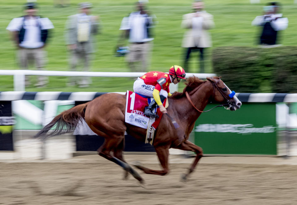 Justify #1, ridden by Mike Smith, wins the Belmont Stakes on Belmont Stakes Day at Belmont Park on June 9, 2018 in Elmont, New York