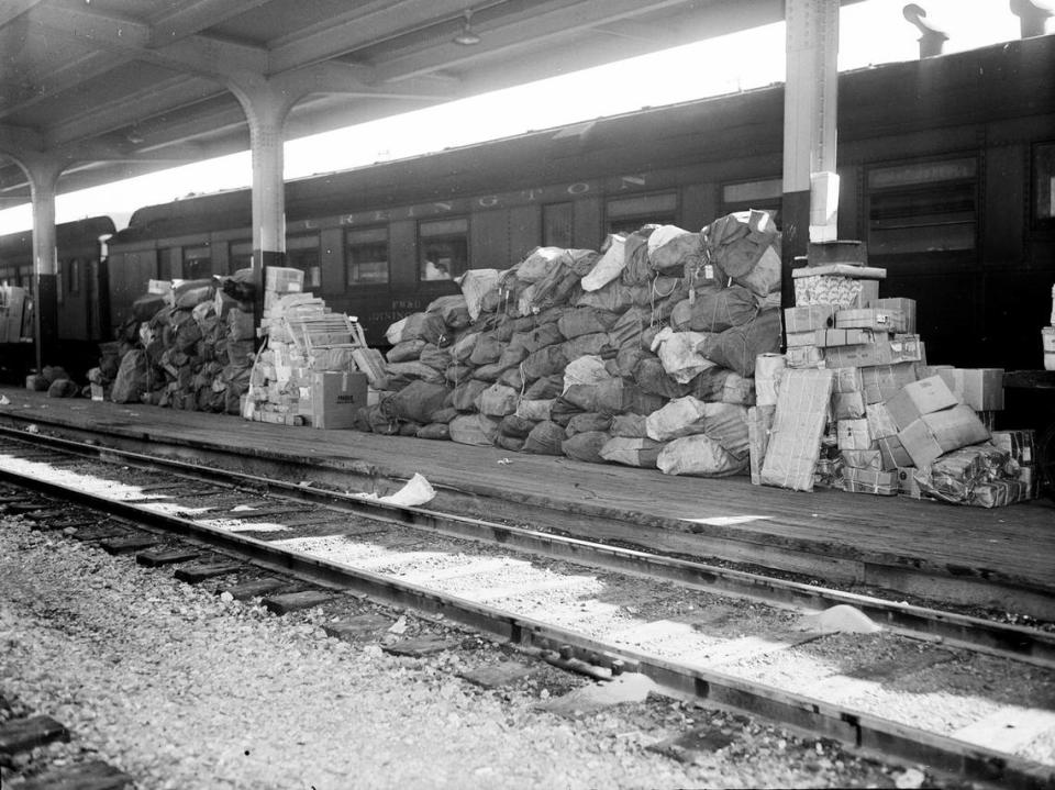 Dec. 17, 1944: Stacks of Christmas mail routed to Fort Worth are piled in front of the railroad tracks behind the post office.