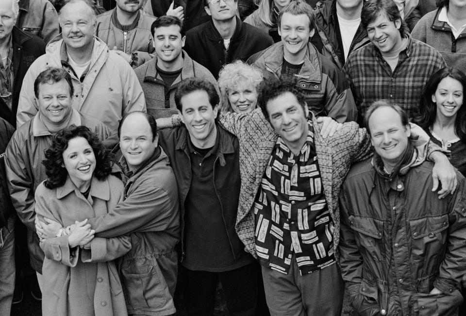 STUDIO CITY, CA - APRIL 3: The cast and crew of the hit television show 'Seinfeld' pose on set during the last days of filming the final episode, April 3, 1998 in Studio City, California.. From left to right in the front row are actors Julia Louis-Dreyfus (Elaine), Jason Alexander (George), Jerry Seinfeld (Jerry), Michael Richards (Kramer), and director Andy Ackerman. (Photo by David Hume Kennerly/Getty Images)