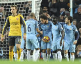 <p>Manchester City’s Leroy Sane, centre, celebrates with team mates after scoring during the English Premier League soccer match between Manchester City and Arsenal at the Etihad Stadium in Manchester, England, Sunday, Dec. 18, 2016. (AP Photo/Rui Vieira) </p>