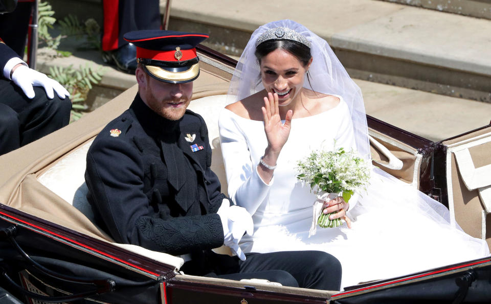 <p>Prince Harry, Duke of Sussex, and Meghan, Duchess of Sussex, leave Windsor Castle in the Landau carriage. (Photo: Andrew Matthews – Pool/Getty Images) </p>