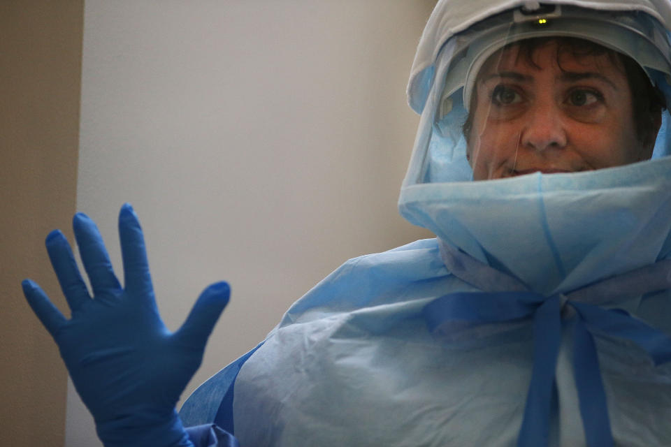 A member of Bellevue's Hospital staff wears protective clothing during a demonstration on how they would receive a suspected Ebola patient on October 8, 2014 in New York City.