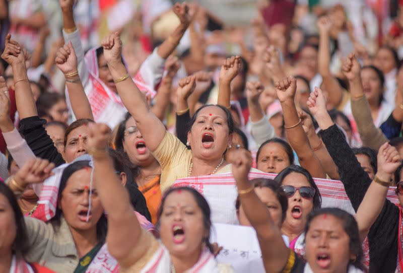 Demonstrators shout slogans during a protest against a new citizenship law in Guwahati