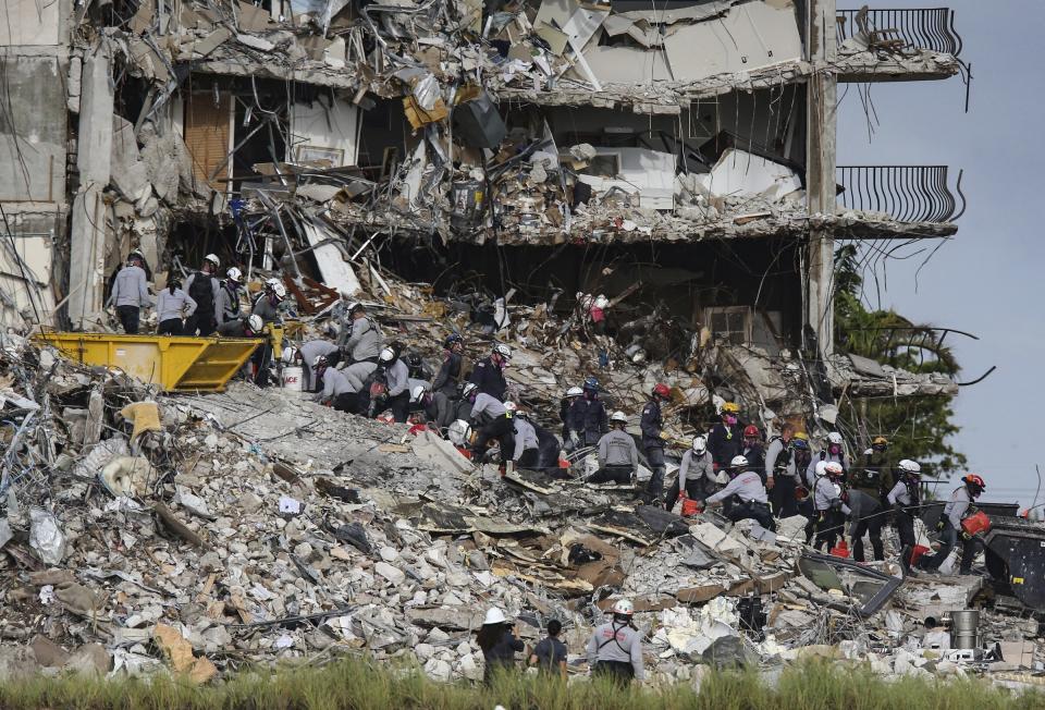 Search and rescue teams look for survivors at the Champlain Towers South residential condo, Tuesday, June 29, 2021, in Surfside, Fla. Many people were still unaccounted for after Thursday's fatal collapse. (Al Diaz /Miami Herald via AP)