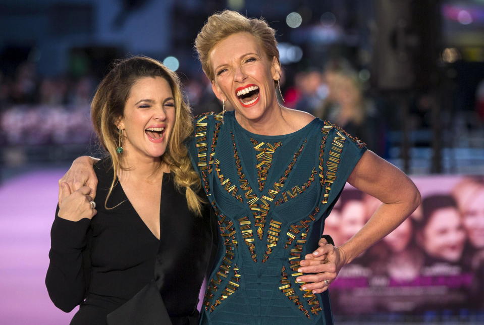 Actors Drew Barrymore (L) and Toni Collette pose for photographers at the European premiere of the film "Miss You Already" in London September 17, 2015. REUTERS/Neil Hall