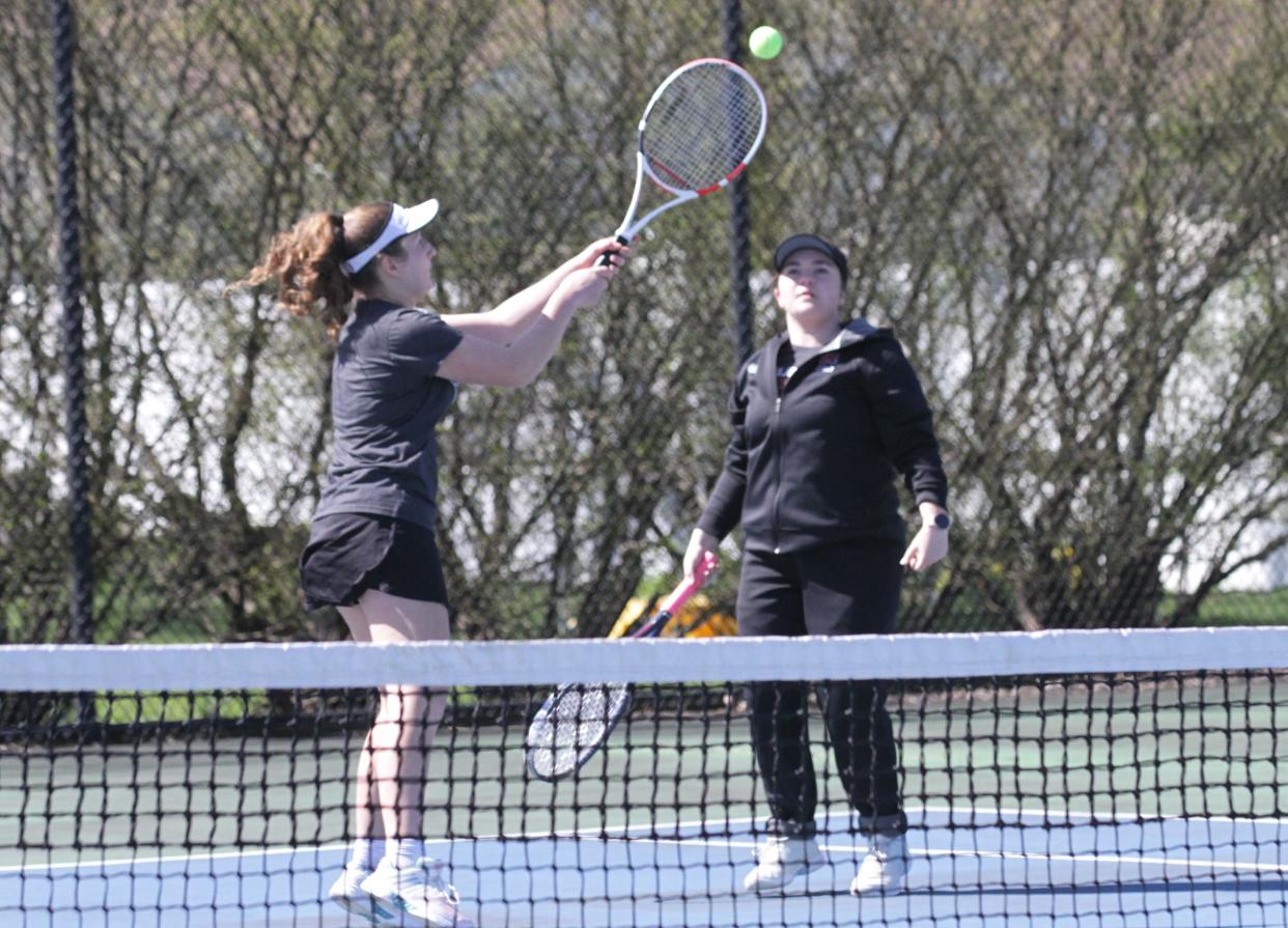 Mya Eicher and Hannah Ritchie send a ball back across the net in one of their matches on Saturday.