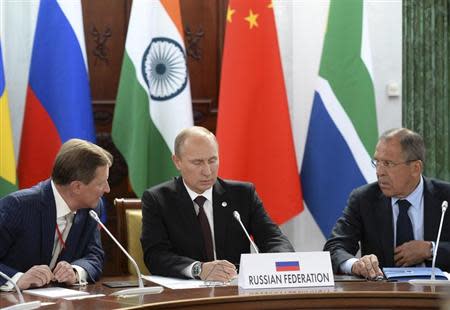 Russia's President Vladimir Putin (C), Foreign Minister Sergei Lavrov (R) and Chief of Staff of the Presidential Administration Sergei Ivanov attend a BRICS leaders' meeting at the G20 Summit in Strelna near St. Petersburg, September 5, 2013. REUTERS/Alexander Vilf