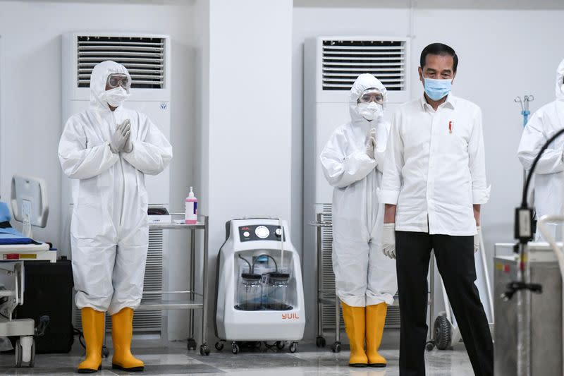 Indonesia's President Joko Widodo takes a look at the emergency hospital handling of COVID-19 in Jakarta