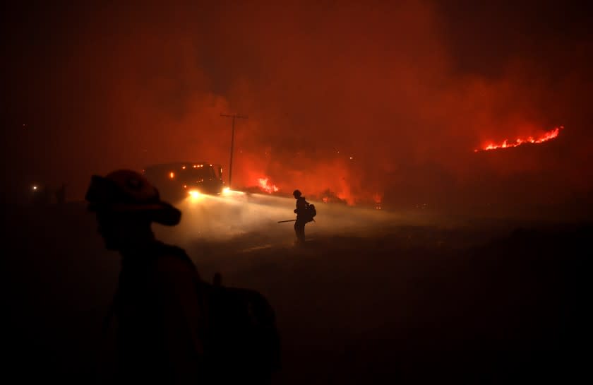 YUCAIPA, CALIFORNIA SEPTEMBER 7, 2020-Firefighters work to put out embers from the El dorado Fire in Tucaipa Monday. (Wally Skalij/Los Angeles Times)