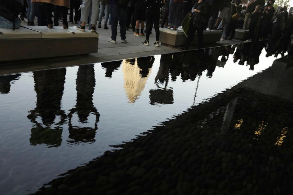 Reflections of protesters in the water