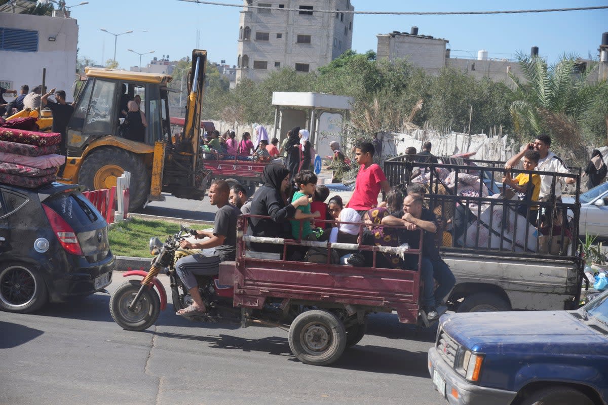 Palestinians flee to the southern Gaza Strip after the Israeli army issued an evacuation warning (Copyright 2023 The Associated Press. All rights reserved.)