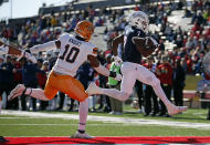 Fresno State running back Jordan Mims (7) leaps into the end zone ahead of UTEP linebacker Tyrice Knight (10) to score a touchdown during the first half of the New Mexico Bowl NCAA college football game Saturday, Dec. 18, 2021, in Albuquerque, N.M. (AP Photo/Andres Leighton)