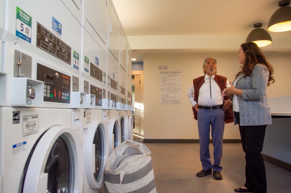 Anette Hoyt-Romero, homeownership adviser at Neighbor to Neighbor, gives County Commissioner John Kefalas a tour of new laundry lounge spaces at the Housing Hub Community Building on Thursday in Fort Collins. Neighbor to Neighbor held an open house to celebrate the opening of its expanded Housing Hub Community Building, which doubled in size and offers new spaces.  A property tax increase on the November ballot to fund city affordable housing initiatives could be used for programs to help nonprofits that provide affordable housing services, like Neighbor to Neighbor.