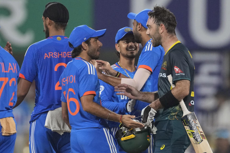 Australia's Glenn Maxwell, right, chats with India players after Australia won the third T20 cricket match against India in Guwahati, India, Tuesday, Nov. 28, 2023. (AP Photo/Anupam Nath)