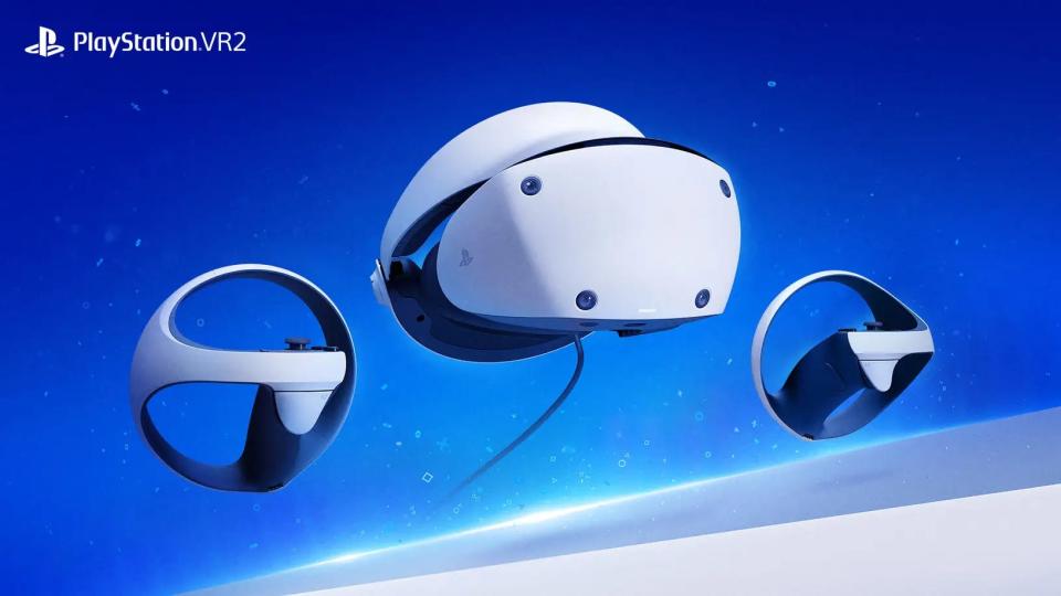 The PlayStation VR2 headset pictured with two controllers against a blue background