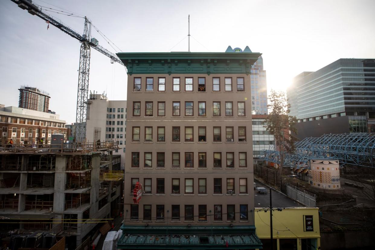 The Hotel Canada SRO is pictured from across the street in Vancouver last year. The province has introduced law amendments that would allow the city to implement vacancy control bylaws in the city's single-room occupancy buildings. (Ben Nelms/CBC - image credit)