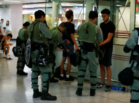 Police patrol at a MTR station as they keep a lookout for protesters in Hong Kong