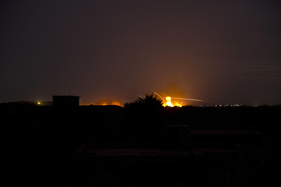 Tracer fire and explosions lights up the night sky as U.S.-backed Syrian Democratic Forces (SDF) fire on Baghouz, Syria, Sunday, March 10, 2019. (AP Photo/Maya Alleruzzo)