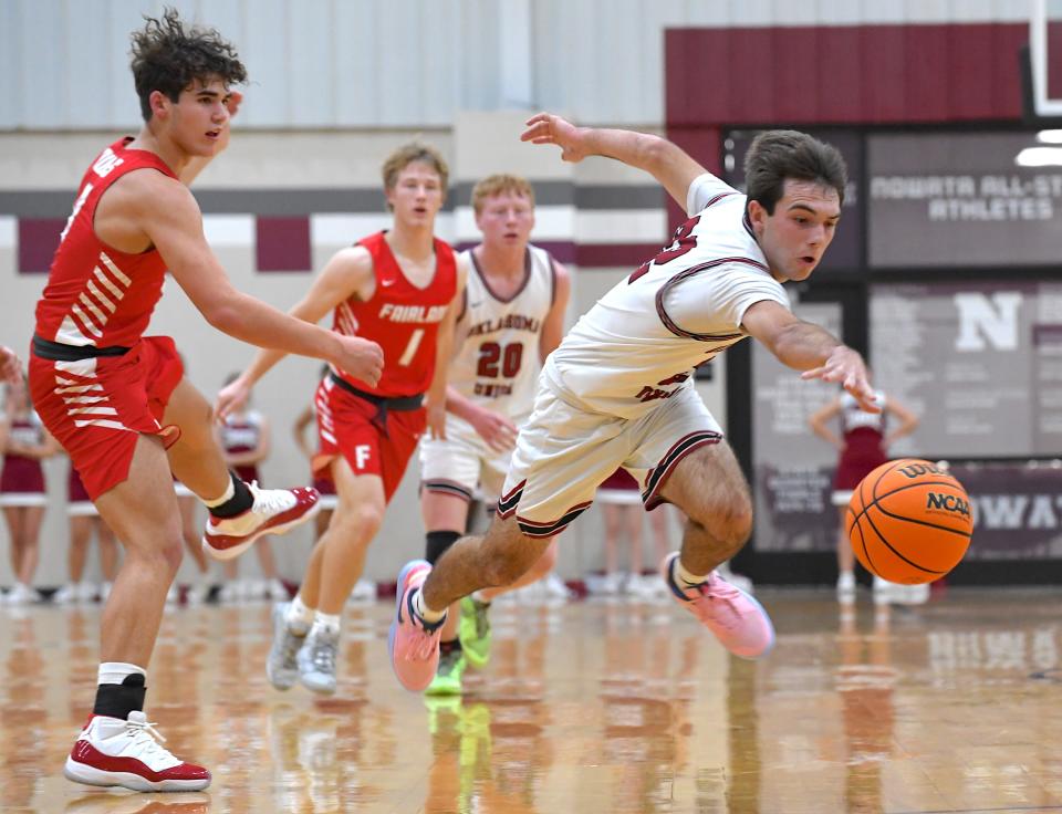Oklahoma Union High School's Bodee West (22) chases down a loose ball during basketball action against Fairland during the Ty Hewitt Memorial Tournament in Nowata on Dec. 4, 2023. The Cougars fell to Fairland 63-49. The annual tournament runs Dec. 4-9, 2023.