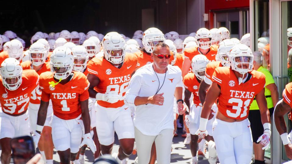 Aug 31, 2024; Austin, Texas, USA; Texas Longhorns head coach Steve Sarkisian leads his team out onto the field at Darrell K Royal-Texas Memorial Stadium. Mandatory Credit: Aaron Meullion-USA TODAY Sports