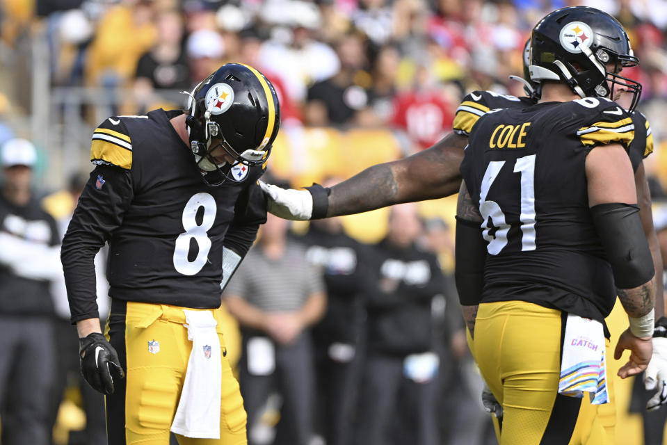 Pittsburgh Steelers quarterback Kenny Pickett (8) is helped on the field after being injured during the second half of an NFL football game against the Tampa Bay Buccaneers in Pittsburgh, Sunday, Oct. 16, 2022. (AP Photo/Barry Reeger)