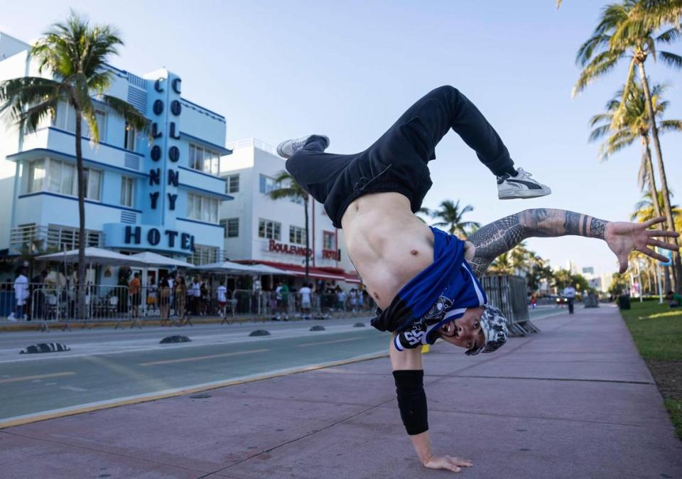 Juan Gama, from Coral Gables, break dances on Ocean Drive during spring break on Friday, March 15, 2024, in Miami Beach. 