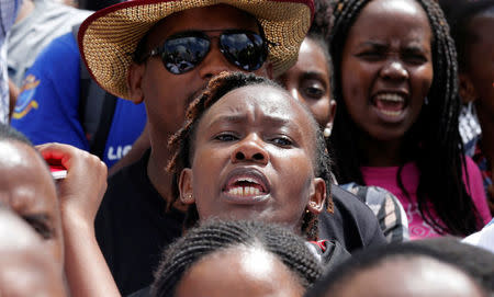 Striking doctors chant slogans outside the Court of Appeal as they wait for the release of jailed officials of the national doctors' union in their case to demand fulfilment of a 2013 agreement between their union and the government that would raise their pay and improve working conditions in Nairobi, Kenya, February 15, 2017. REUTERS/Thomas Mukoya