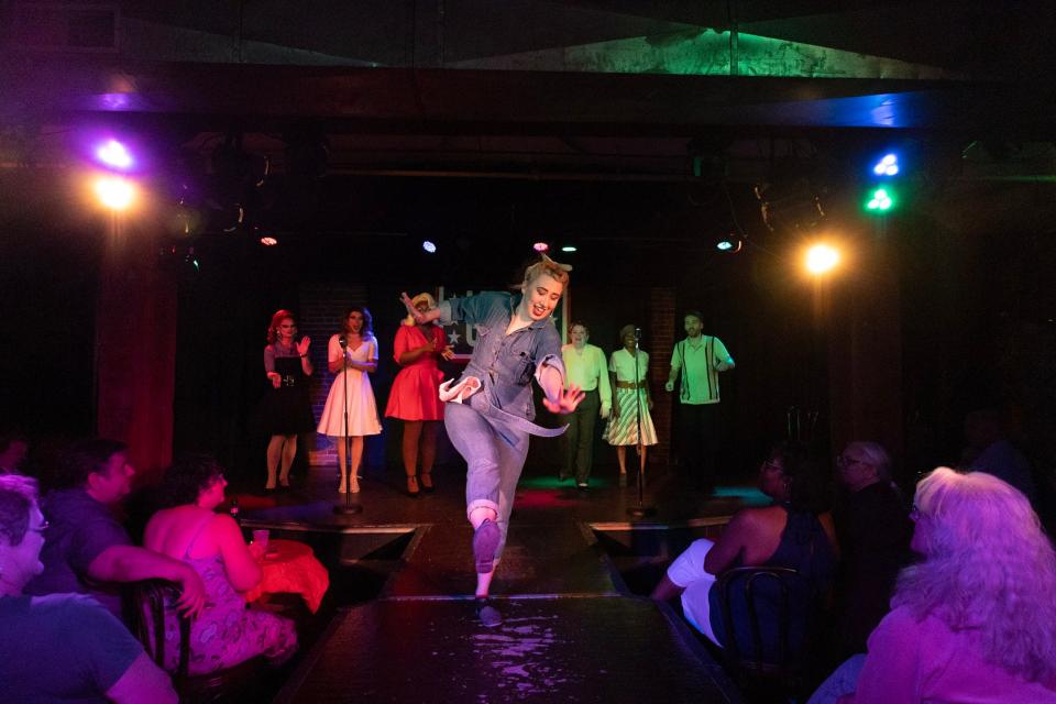 Hannah Dodson dances with the ensemble during an April 2022 performance of “Time Traveling Drag Queens in the 1940s!” at the Bay Street Cabaret.