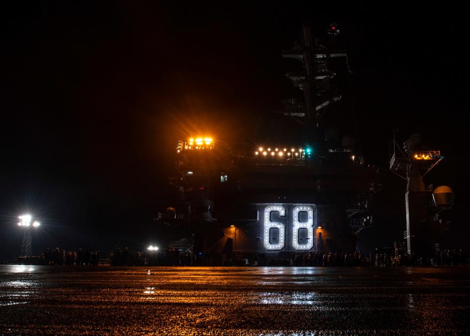 Sailors aboard the aircraft carrier USS Nimitz (CVN 68) participate in a general quarters drill on the flight deck during a fast cruise aboard the aircraft carrier USS Nimitz (CVN 68). The fast cruise consists of equipment tests, simulations, scenarios, which refresh and train Sailors for underway periods.