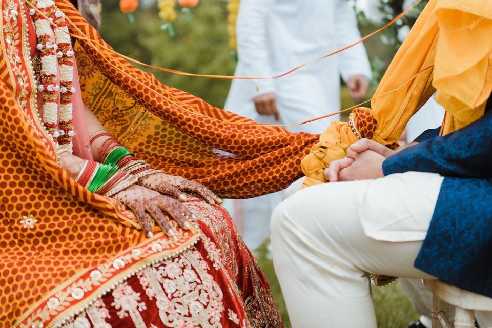 Alastair Spray and Angie Tiwari on their wedding day.