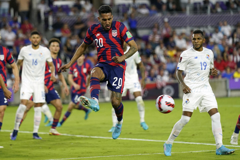 United States' Jesus Ferreira (20) clears the ball from the goal area on a Panama corner kick as Panama's Alberto Quintero (19) looks on during the first half of a FIFA World Cup qualifying soccer match, Sunday, March 27, 2022, in Orlando, Fla. (AP Photo/John Raoux)