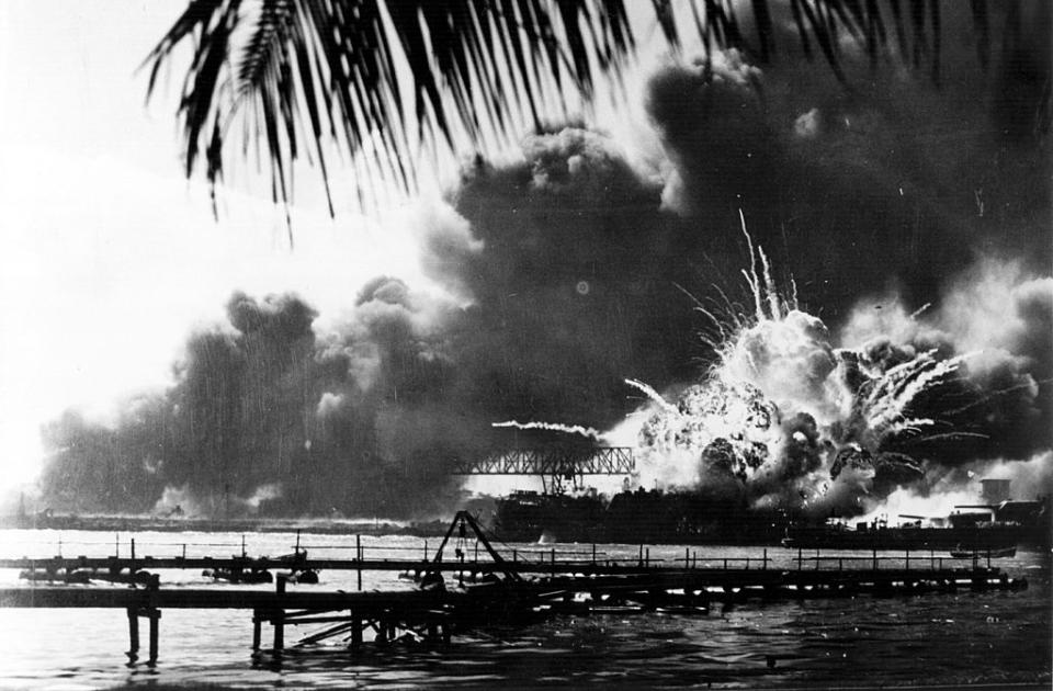 The American destroyer <em>USS Shaw</em> explodes during the Japanese attack on Pearl Harbor, home of the American Pacific Fleet during World War II, December 7, 1941.<span class="copyright">Keystone/Hulton Archive—Getty Images</span>