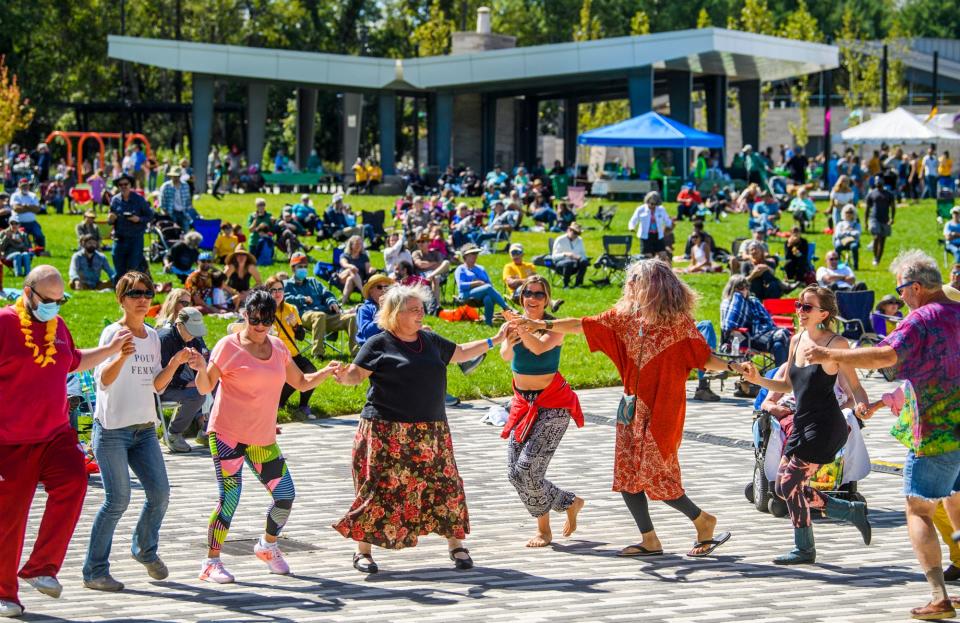 Festivalgoers dance during Lotus in the Park at Switchyard Park in 2021.