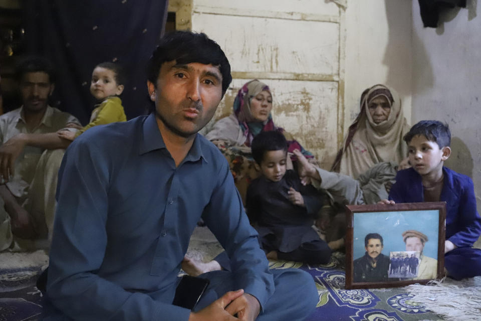Bisharat Ali, a childhood friend of Mohammed Hassan, a Pakistani porter who died on July 27 during a summit of K2, speaks during an interview accompanied by Hassan's family at their home in Tasar, a village in the Shigar district in the Gilgit-Baltistan region of northern Pakistan, Saturday, Aug. 12, 2023. An investigation has been launched into the death of a Hassan near the peak of the world's most treacherous mountain, a Pakistani mountaineer said Saturday, following allegations that dozens of climbers eager to reach the summit had walked past the man after he was gravely injured in a fall. (AP Photo/M.H. Balti)
