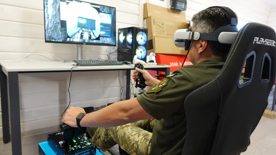 Oleksii Diakiv, head of the training command for the Air Force of Ukraine, operates an F-16 fighter jet through a virtual simulator computer program. (Courtesy Alexander Gorgan)