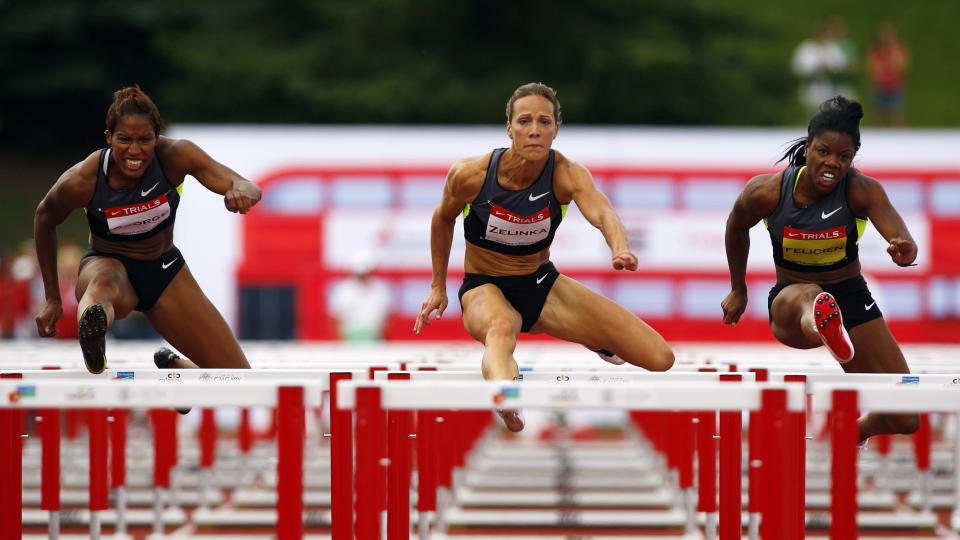 Jessica Zelinka, centre, from London, Ont., out races Phylicia George, left, and Perdita Felicien, to victory in the women's 100-metre hurdles at the Canadian Track and Field Championships in Calgary, Alta., Saturday, June 30, 2012.THE CANADIAN PRESS/Jeff McIntosh