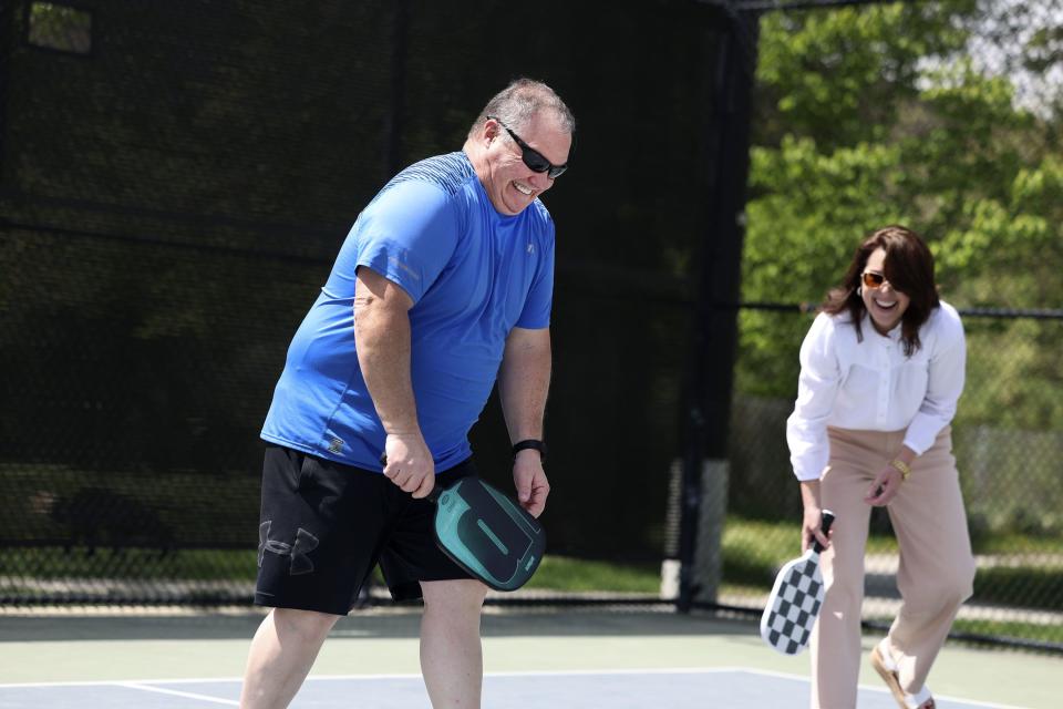 Mark Mitchell and Lt. Gov. Deidre Henderson laugh while playing pickleball during a staff picnic at Fairmont Park in Salt Lake City on Friday, May 12, 2023. | Laura Seitz, Deseret News