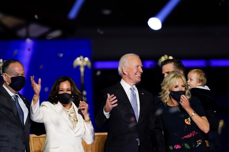 President-elect Joe Biden, his wife Jill Biden, and members of the Biden family, along with Vice President-elect Kamala Harris, her husband Doug Emhoff stand on stage on Nov. 7, 2020, in Wilmington, Del.